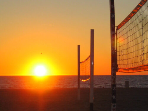 Beach volleyball courts at sunset